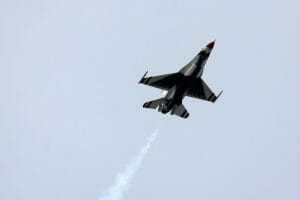 fighter jet soaring in the sky