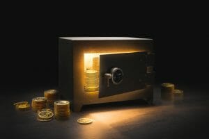 A safe with a door partially open showing piles of gold coins.