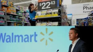 A Walmart worker stocking shelves above a picture of Doug McMillon, Walmart's CEO.